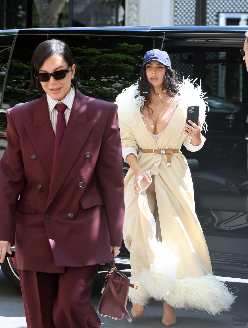 Kim Kardashian stepped out in Paris wearing a cream feathery coat from Conner Ives