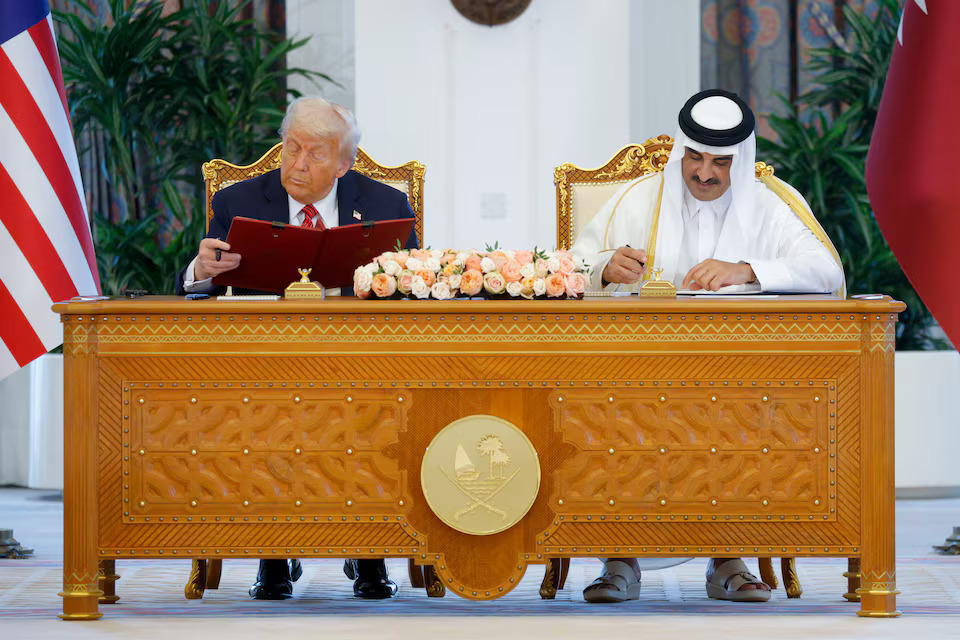 U.S. President Donald Trump and Qatar's Emir Tamim bin Hamad Al Thani attend a signing ceremony in Doha, Qatar, May 14, 2025