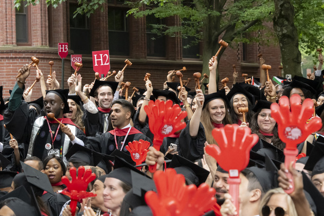 Students cheer during the 374th Harvard Commencement in Harvard Yard in Cambridge, Massachusetts, on May 29, 2025. | Rick Friedman/AFP via Getty Images