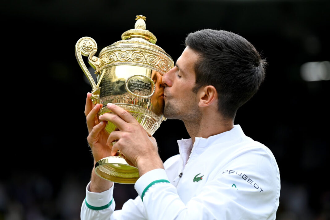 Novak Djokovic holds the trophy after winning his sixth Wimbledon Men's Single Final at Wimbledon Championships Tennis Tournament at All England Lawn Tennis and Croquet Club on July 11, 2021 in London