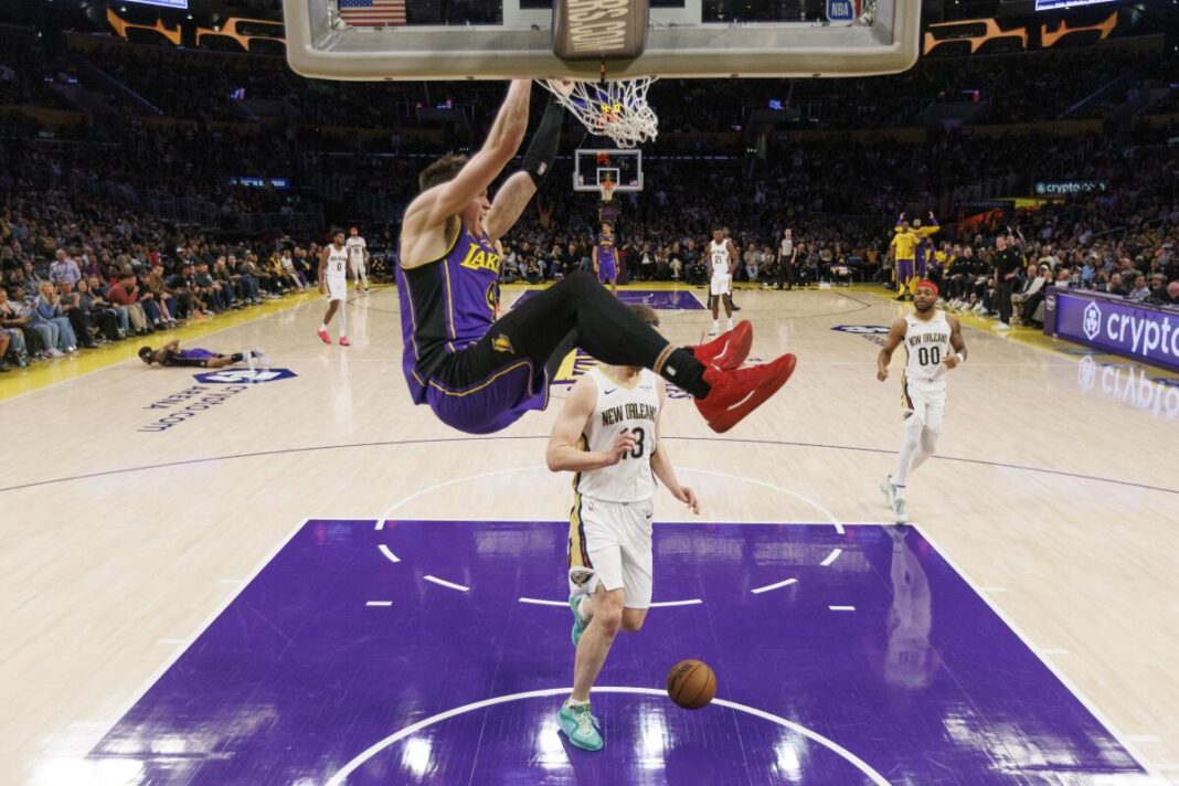 Lakers guard Dalton Knecht, finishing a dunk against the Pelicans, is one of the mainstays of the Summer League team